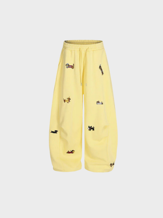 Yellow pants with black patterns on a light gray background